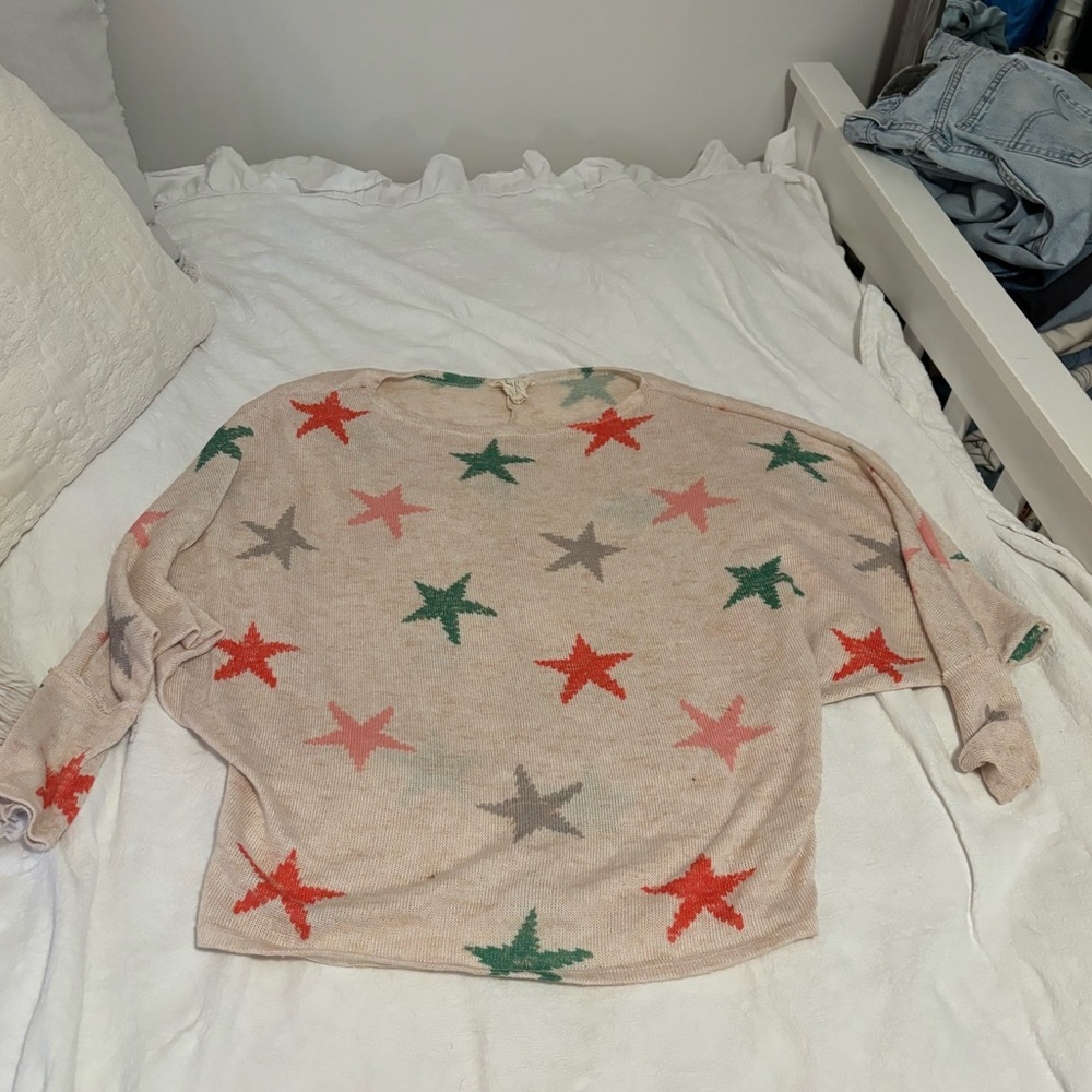 Small off the shoulder sweater with stars